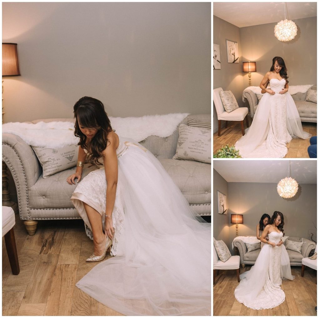 Premier snohomish & seattle wedding photographer | gsquared weddings photography a bride in a white wedding gown sits on a sofa adjusting her shoe then stands as another woman helps with her dress in a cozy softly lit room with elegant decora perfect snohomish seattle wedding moment | serving snohomish seattle                   & beyond