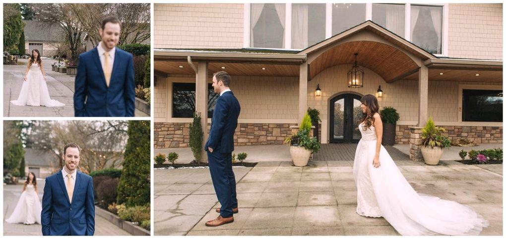 Premier snohomish & seattle wedding photographer | gsquared weddings photography a bride in a white gown approaches her groom in a blue suit from behind for a first look outside a snohomish building with stone and wood accents The groom smiles as the bride glowing with seattle wedding excitement walks towards him | serving snohomish seattle                   & beyond