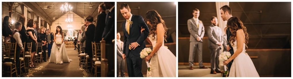 Premier snohomish & seattle wedding photographer | gsquared weddings photography a bride walks down the aisle at a warmly lit snohomish venue then stands at the altar holding a bouquet next to the groom as groomsmen look on Guests are seated along an aisle decorated with white petals | serving snohomish seattle                   & beyond
