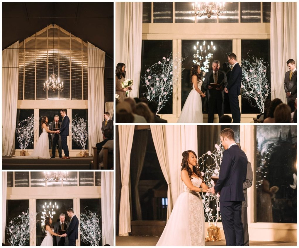 Premier snohomish & seattle wedding photographer | gsquared weddings photography a bride and groom stand together at the altar exchanging vows in a softly lit indoor snohomish setting with tall windows elegant drapes and white decorative branches Guests watch as they hold hands and smile at this seattle wedding moment | serving snohomish seattle                   & beyond