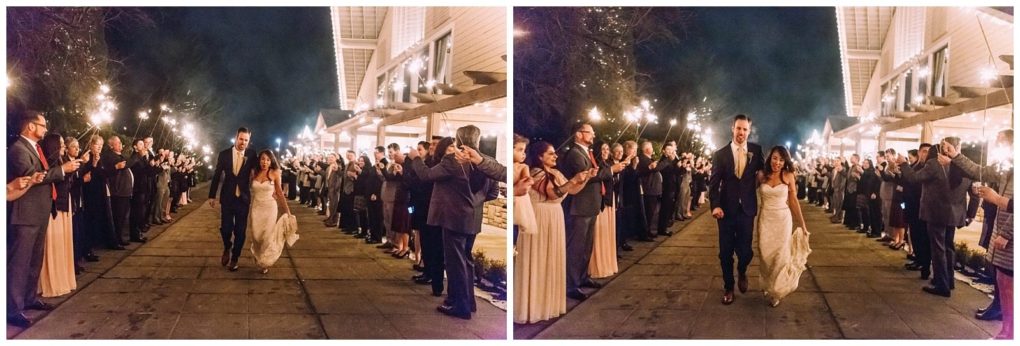 Premier snohomish & seattle wedding photographer | gsquared weddings photography a bride and groom walk hand in hand down an outdoor path at night during their snohomish wedding surrounded by guests holding sparklers and cheering The scene is lively and joyful filled with warm lighting and celebration | serving snohomish seattle                   & beyond