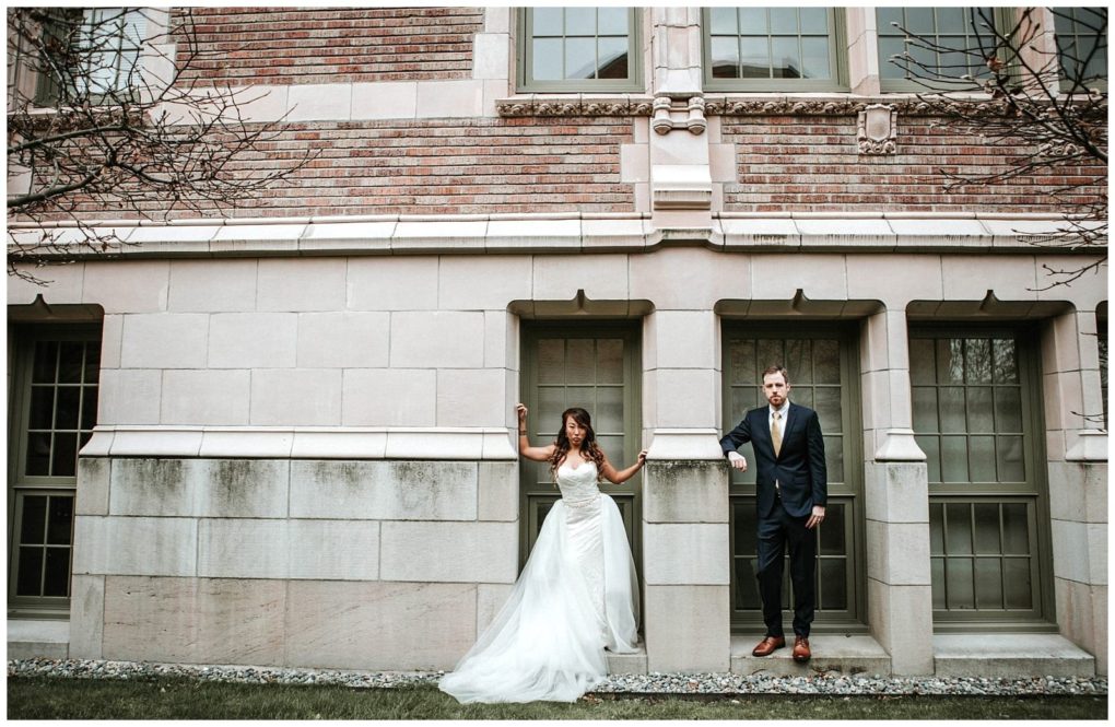 Premier snohomish & seattle wedding photographer | gsquared weddings photography a bride in a white gown and a groom in a dark suit stand side by side in separate doorways of a stone building with large windows posing for a modern and artistic snohomish seattle wedding photo | serving snohomish seattle                   & beyond