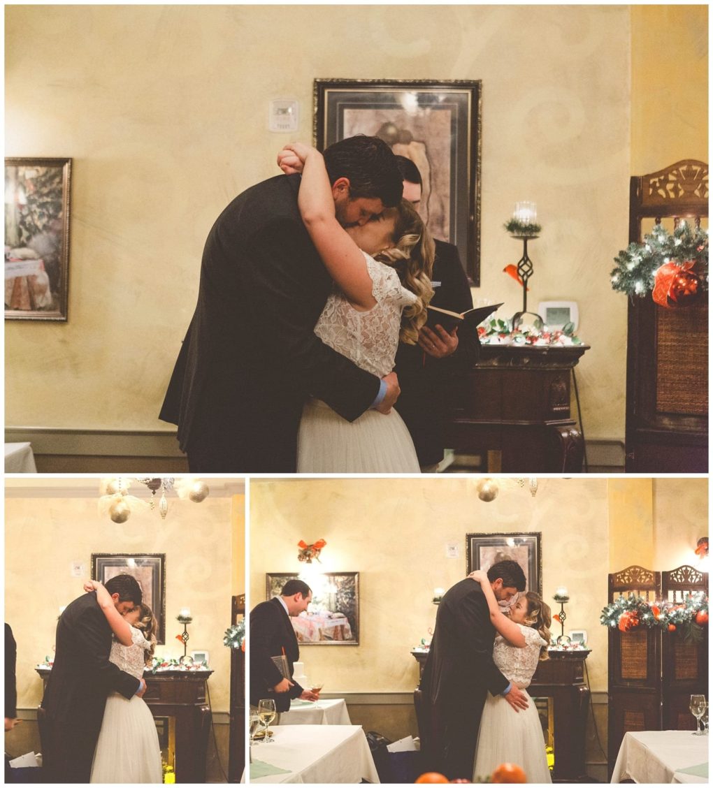 Premier snohomish & seattle wedding photographer | gsquared weddings photography a bride and groom embrace and share a kiss during their snohomish wedding ceremony in a warmly decorated indoor setting with a man standing behind them reading from a book | serving snohomish seattle                   & beyond