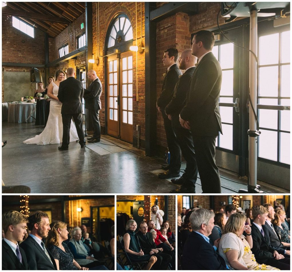 Premier snohomish & seattle wedding photographer | gsquared weddings photography a bride and groom stand with an officiant in front of large windows during a snohomish wedding ceremony with groomsmen beside them and guests seated watching attentively in a warmly lit brick venue | serving snohomish seattle                   & beyond