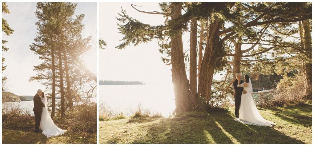 Premier snohomish & seattle wedding photographer | gsquared weddings photography a bride and groom stand close together beneath tall trees by a sunlit lake in snohomish with soft light streaming through the branches creating a romantic and serene seattle wedding atmosphere | serving snohomish seattle                   & beyond
