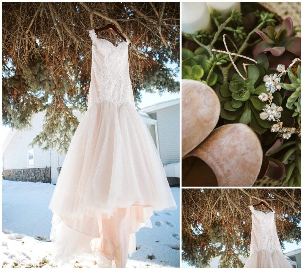Premier snohomish & seattle wedding photographer | gsquared weddings photography a lace and tulle wedding dress hangs from a tree in the snow at a snohomish seattle wedding nearby blush shoes a necklace and earrings rest on green succulents | serving snohomish seattle                   & beyond