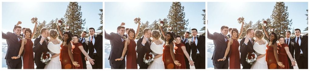 Premier snohomish & seattle wedding photographer | gsquared weddings photography a wedding party poses joyfully outdoors in winter near snohomish The bride and groom kiss while bridesmaids in red dresses and groomsmen in dark suits cheer with arms raised surrounded by snow and evergreen trees | serving snohomish seattle                   & beyond