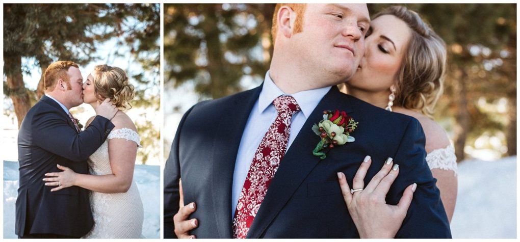Premier snohomish & seattle wedding photographer | gsquared weddings photography a bride in a lace gown and a groom in a navy suit with a red floral tie embrace outdoors surrounded by snowy trees The bride kisses the grooms cheek as they share a joyful moment during their dreamy snohomish seattle wedding | serving snohomish seattle                   & beyond