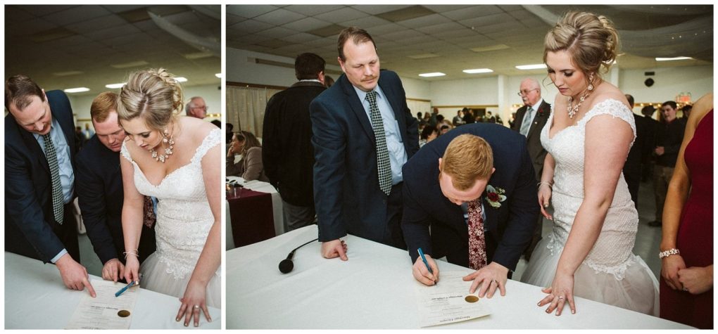 Premier snohomish & seattle wedding photographer | gsquared weddings photography a bride and groom sign a marriage certificate at a table while a man in a suit points to the document Guests watch in the background at this elegant snohomish wedding ceremony near seattle | serving snohomish seattle                   & beyond