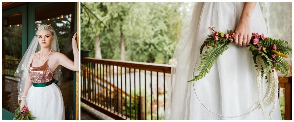 Premier snohomish & seattle wedding photographer | gsquared weddings photography a bride in a white skirt and sparkly rose gold top stands near a wooden railing at her snohomish wedding holding a circular floral arrangement of ferns and pink flowers She wears a veil pearls and vintage inspired hair and makeup | serving snohomish seattle                   & beyond