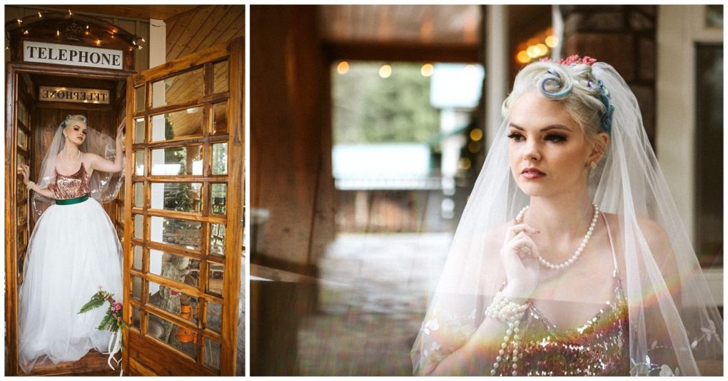 Premier snohomish & seattle wedding photographer | gsquared weddings photography a bride with white hair styled in vintage curls and a veil wears a sequin top and white skirt She poses inside a wooden phone booth during her romantic snohomish seattle wedding engagement holding her veil with a dreamy expression and pearl necklaces | serving snohomish seattle                   & beyond