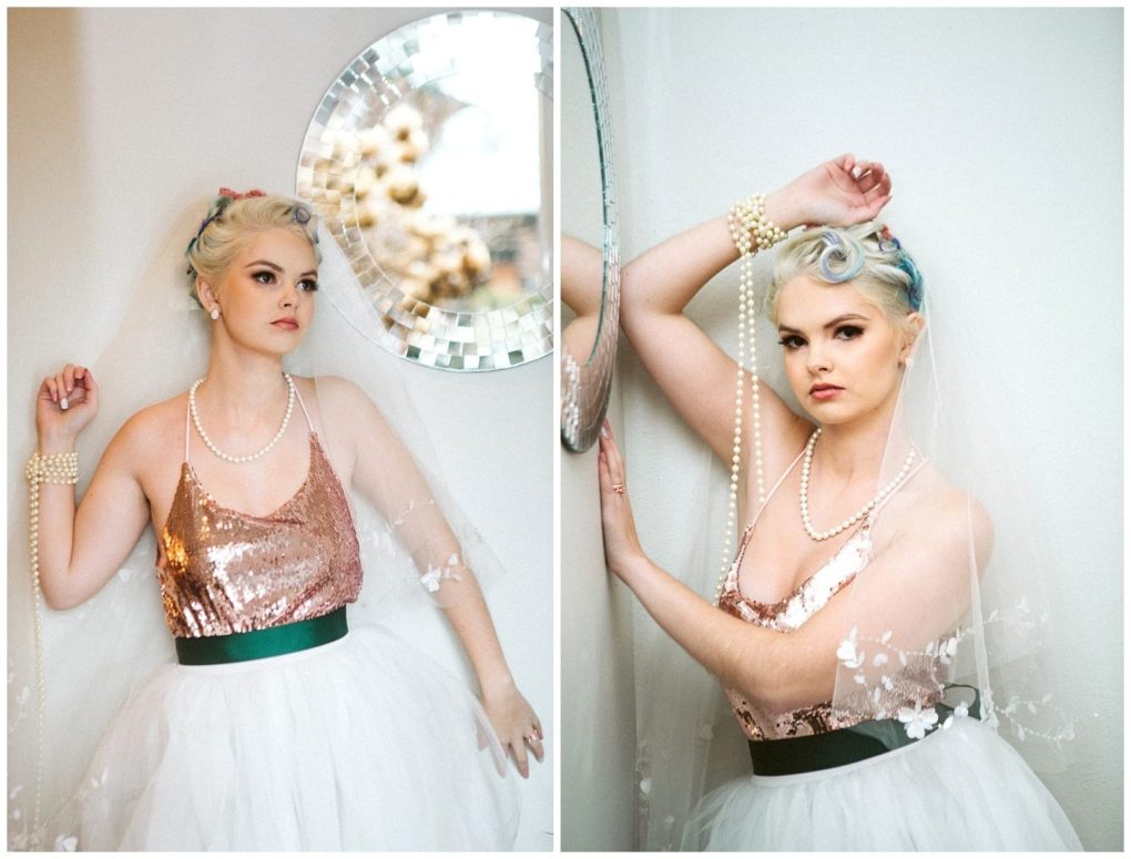 Premier snohomish & seattle wedding photographer | gsquared weddings photography a woman in a sequin top and white tulle skirt poses indoors by a round mirror wearing a veil pearls and retro styled haircapturing the essence of a snohomish seattle wedding engagement as she gazes confidently at the camera | serving snohomish seattle                   & beyond