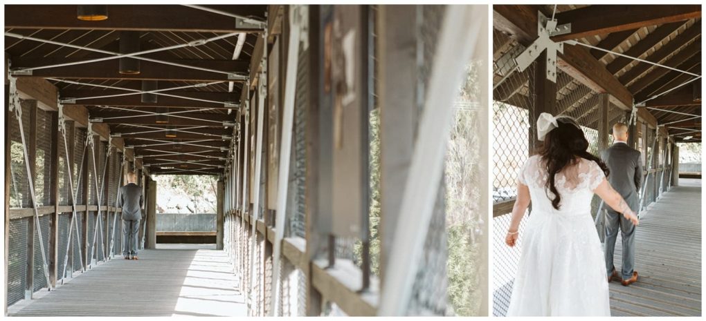Premier snohomish & seattle wedding photographer | gsquared weddings photography a bride in a white dress walks towards a groom in a gray suit for a first look on a covered wooden bridge sunlight streaming through the open sides at this romantic snohomish wedding | serving snohomish seattle                   & beyond
