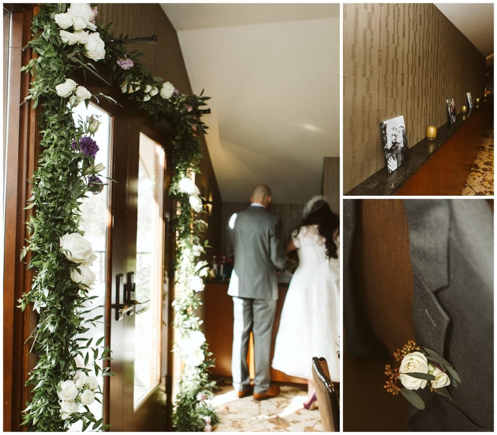 Premier snohomish & seattle wedding photographer | gsquared weddings photography a floral arch frames a wooden door as a bride and groom stand together inside Perfect for a snohomish seattle wedding nearby a shelf holds candles and photos and a boutonniere with white roses is pinned to a gray suit | serving snohomish seattle                   & beyond