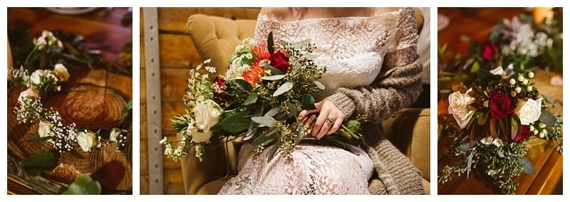 Premier snohomish & seattle wedding photographer | gsquared weddings photography a woman in a lace dress holds a bouquet of red white and green flowers floral arrangements and a flower crown are displayed nearby on a wooden table at this charming snohomish seattle wedding | serving snohomish seattle                   & beyond