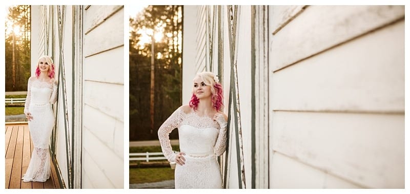 Premier snohomish & seattle wedding photographer | gsquared weddings photography a woman in a long sleeved white lace dress with pink hair stands by a rustic white wooden building at sunset looking content and relaxeda serene snohomish wedding or engagement scene near seattle with trees and a white fence behind her | serving snohomish seattle                   & beyond