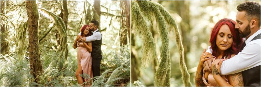 Premier snohomish & seattle wedding photographer | gsquared weddings photography a couple embraces in a sunlit forest near snohomish surrounded by lush green ferns and moss The woman with red hair wears a light pink dress while the man stands behind hercapturing a serene seattle wedding engagement moment | serving snohomish seattle                   & beyond