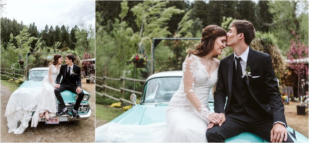 Premier snohomish & seattle wedding photographer | gsquared weddings photography a bride and groom sit on the hood of a vintage turquoise car the groom kisses the brides forehead as they hold hands surrounded by greenery and rustic outdoor decor at a charming snohomish seattle wedding | serving snohomish seattle                   & beyond
