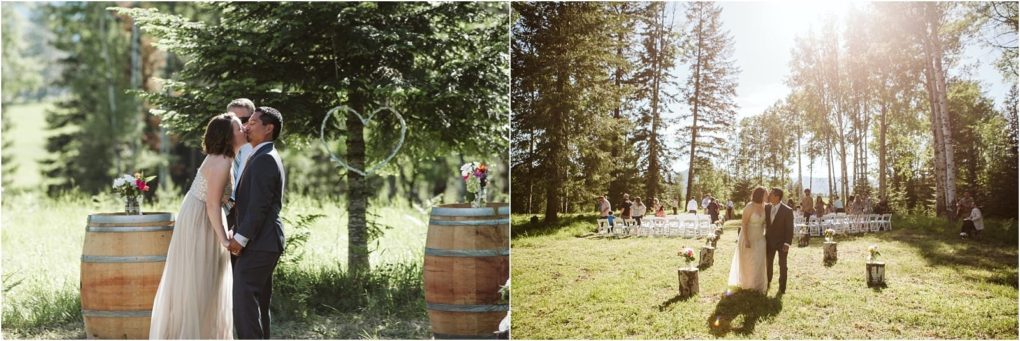 Premier snohomish & seattle wedding photographer | gsquared weddings photography a bride and groom share a kiss during an outdoor forest wedding ceremony in snohomish near seattle They stand between two barrels with flower arrangements as sunlight filters through the trees and guests sit on white chairs in the background | serving snohomish seattle                   & beyond