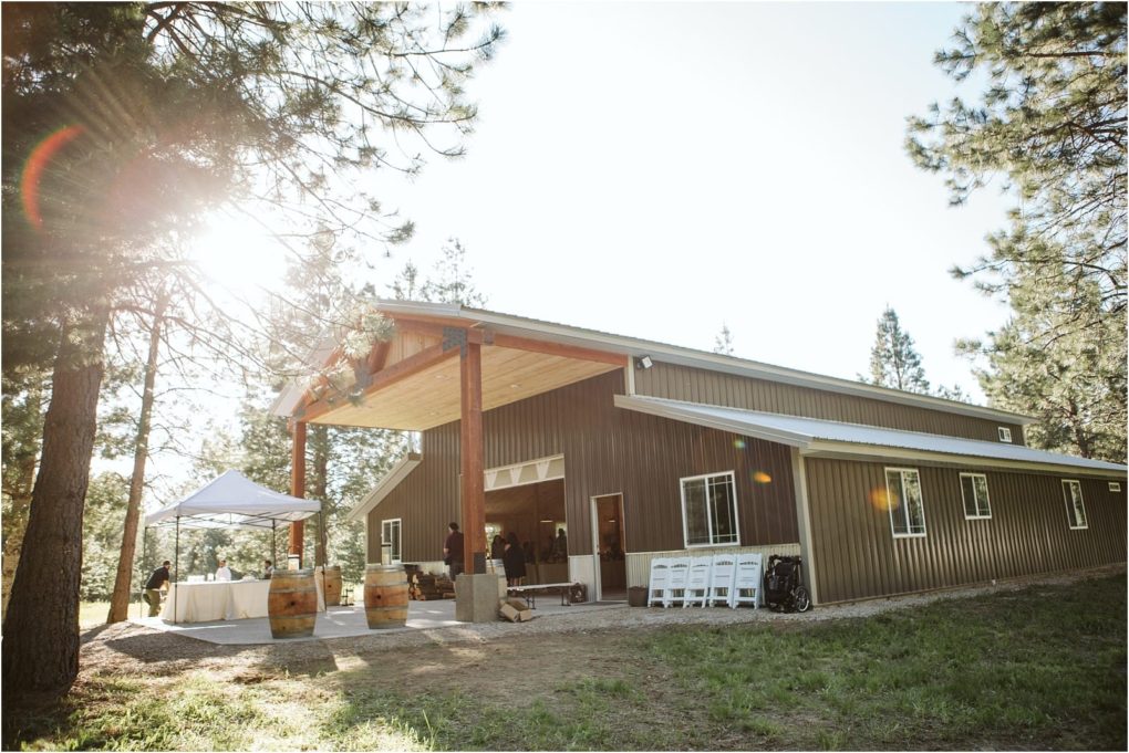 Premier snohomish & seattle wedding photographer | gsquared weddings photography a rustic metal barn style event venue near snohomish is perfect for seattle wedding or engagement celebrations Wooden beams tall pines and sunlight create a dreamy setting with white chairs and a canopy outside | serving snohomish seattle                   & beyond
