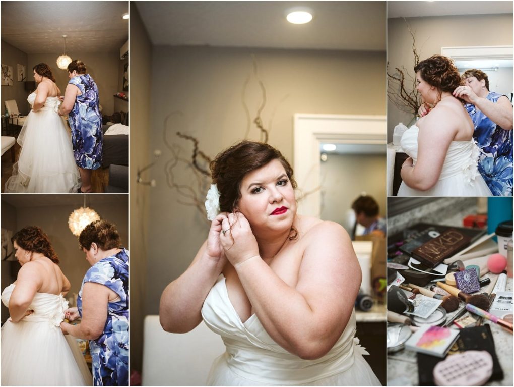 Premier snohomish & seattle wedding photographer | gsquared weddings photography a bride in a white gown gets ready for her snohomish wedding with help from a woman in a blue dress adjusting her dress and earrings as makeup items are spread out on a vanity | serving snohomish seattle                   & beyond