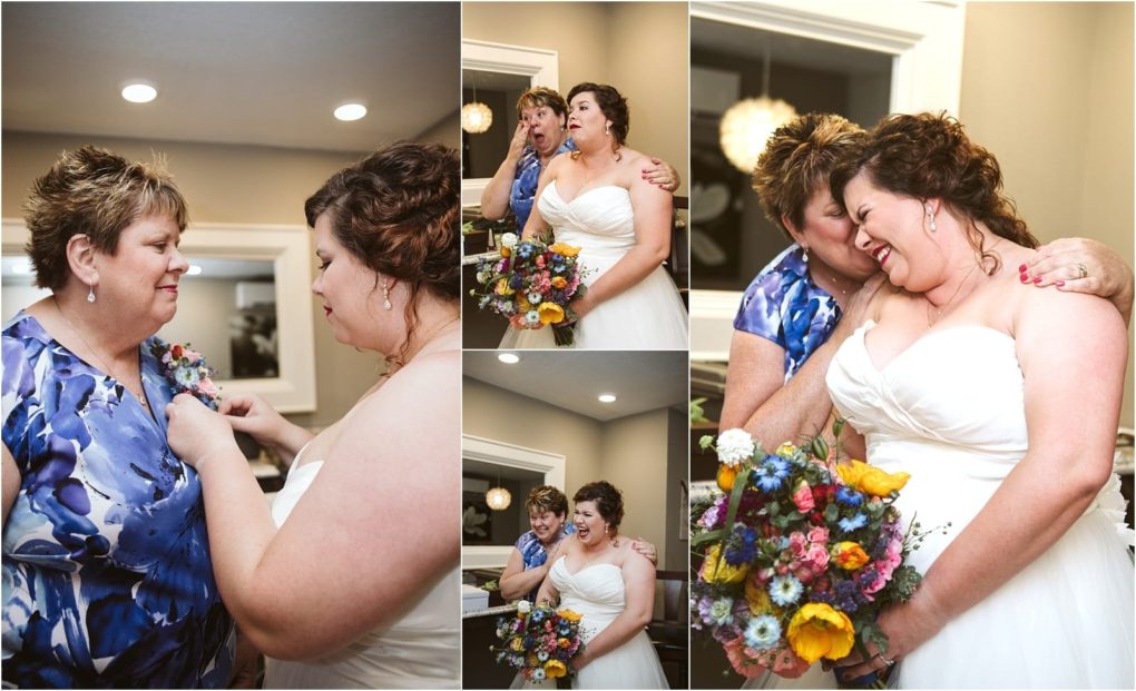 Premier snohomish & seattle wedding photographer | gsquared weddings photography a bride in a white dress shares joyful emotional moments with a woman in a blue floral blouse at their snohomish seattle wedding exchanging smiles hugs and laughter while holding a colorful bouquet indoors | serving snohomish seattle                   & beyond