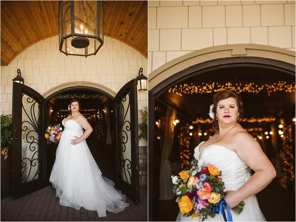 Premier snohomish & seattle wedding photographer | gsquared weddings photography a bride in a strapless white wedding gown holds a colorful bouquet posing confidently in front of ornate double doors with warm glowing lightsa classic scene from a beautiful snohomish seattle wedding | serving snohomish seattle                   & beyond