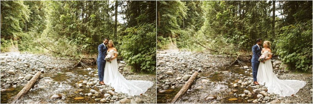 Premier snohomish & seattle wedding photographer | gsquared weddings photography a bride and groom stand together on rocks by a shallow creek in a forest near snohomish embracing and smiling The bride wears a long white dress the groom a blue suit Green trees and a fallen log set the scene for this seattle wedding moment | serving snohomish seattle                   & beyond