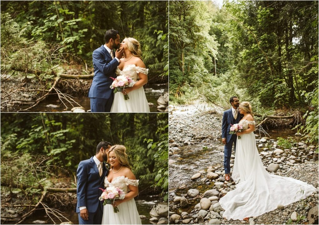 Premier snohomish & seattle wedding photographer | gsquared weddings photography a bride and groom share romantic moments by a forest stream during their snohomish seattle wedding surrounded by lush greenery and rocks The groom wears a blue suit while the bride in an off shoulder white gown holds a bouquet | serving snohomish seattle                   & beyond