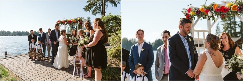 Premier snohomish & seattle wedding photographer | gsquared weddings photography a snohomish wedding ceremony by a lake features a couple holding hands under a flower adorned arch surrounded by loved ones The sun is shining children stand nearby and trees and water create the perfect backdrop for this special celebration | serving snohomish seattle                   & beyond