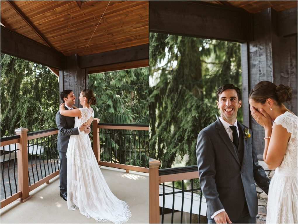 Premier snohomish & seattle wedding photographer | gsquared weddings photography a bride and groom share an emotional first look on a covered outdoor balcony surrounded by lush green trees at their snohomish seattle wedding the groom smiles while the bride covers her face with her hands visibly moved | serving snohomish seattle                   & beyond