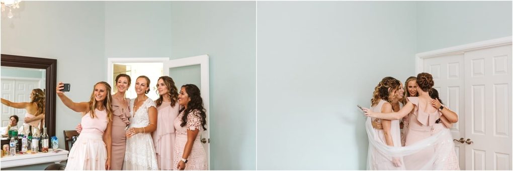 Premier snohomish & seattle wedding photographer | gsquared weddings photography a group of women in light pink dresses stand together and smile for a selfie in a bright room at a snohomish seattle wedding on the right two women hug near a closed white door | serving snohomish seattle                   & beyond