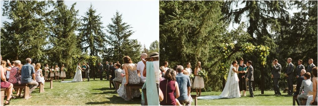 Premier snohomish & seattle wedding photographer | gsquared weddings photography an outdoor snohomish wedding ceremony with guests seated on wooden benches facing a couple under a floral arch surrounded by tall green trees on a sunny dayperfect for seattle engagement celebrations | serving snohomish seattle                   & beyond