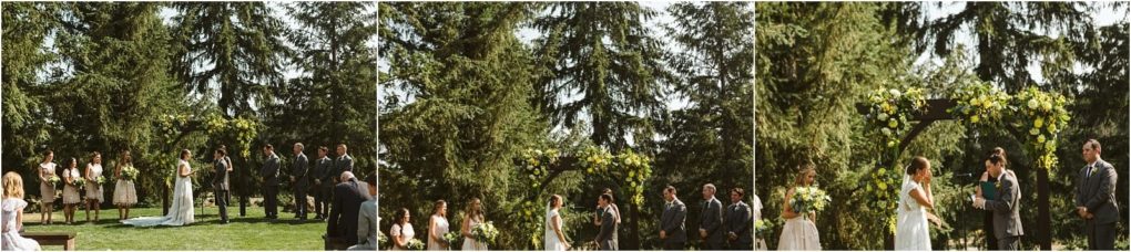 Premier snohomish & seattle wedding photographer | gsquared weddings photography a beautiful snohomish wedding ceremony outdoors under tall trees with the couple officiant and wedding party by a flower adorned arch on a sunny day Guests are seated on the lawn celebrating love near seattle | serving snohomish seattle                   & beyond