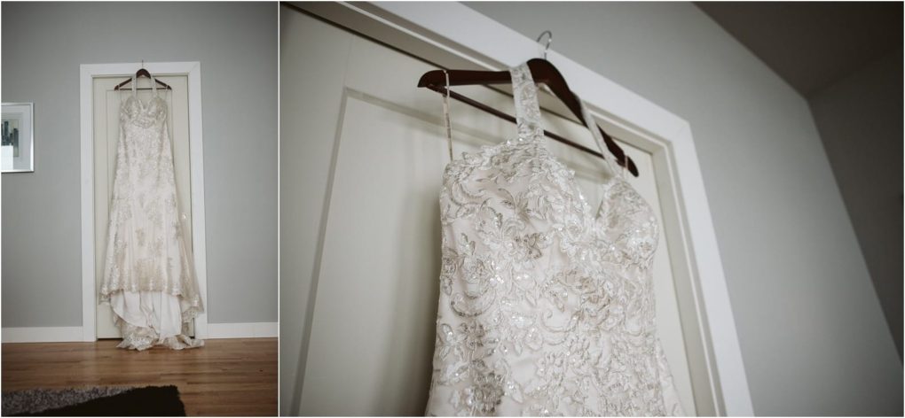 Premier snohomish & seattle wedding photographer | gsquared weddings photography a white intricately beaded wedding dress hangs on a wooden hanger from the top of a white door in a minimalist room with gray walls and a wooden floor ready for a snohomish seattle wedding or engagement celebration | serving snohomish seattle                   & beyond