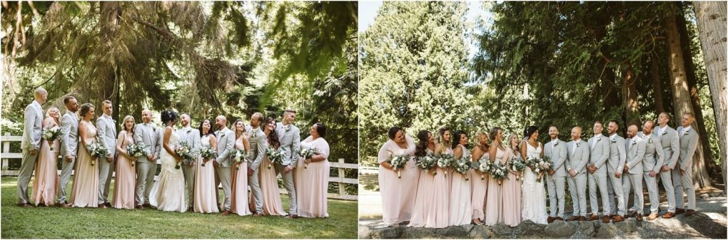Premier snohomish & seattle wedding photographer | gsquared weddings photography a wedding party stands outdoors in snohomish surrounded by tall trees Bridesmaids wear light pink dresses and hold bouquets while groomsmen in light gray suits smile together capturing the joy of a seattle wedding engagement | serving snohomish seattle                   & beyond