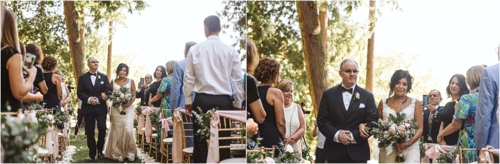 Premier snohomish & seattle wedding photographer | gsquared weddings photography a bride in a white gown and veil walks down an outdoor aisle with an older man in a tuxedo at a snohomish seattle wedding surrounded by guests seated on decorated chairs under trees | serving snohomish seattle                   & beyond