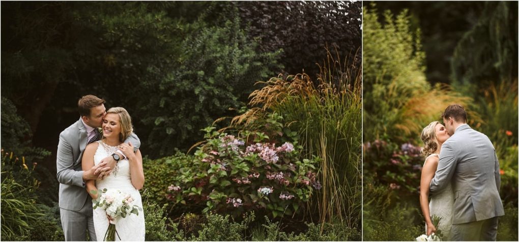 Premier snohomish & seattle wedding photographer | gsquared weddings photography a bride and groom stand embracing in a lush garden at their snohomish seattle wedding The groom in a light gray suit holds the smiling bride who wears a white dress and holds a bouquet vibrant greenery and flowers surround them | serving snohomish seattle                   & beyond