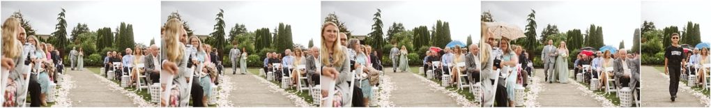Premier snohomish & seattle wedding photographer | gsquared weddings photography a wide outdoor wedding aisle lined with white chairs guests seated on both sidessome holding umbrellas Trees and greenery frame the scene under a cloudy sky at this enchanting snohomish seattle wedding | serving snohomish seattle                   & beyond