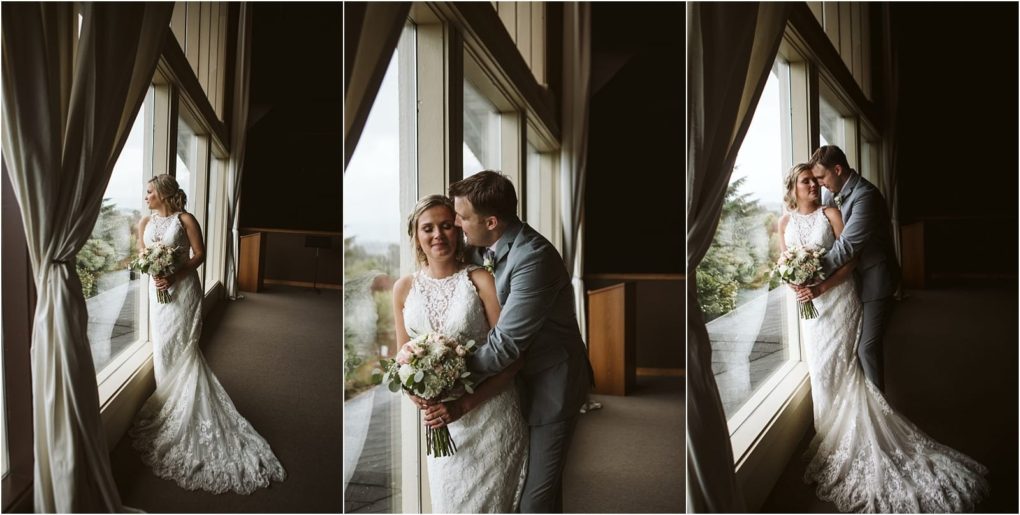 Premier snohomish & seattle wedding photographer | gsquared weddings photography a bride in a lace gown holding a bouquet stands by a large window with curtains joined by the groom in a gray suit who embraces her both look happy and in love during their snohomish seattle wedding | serving snohomish seattle                   & beyond