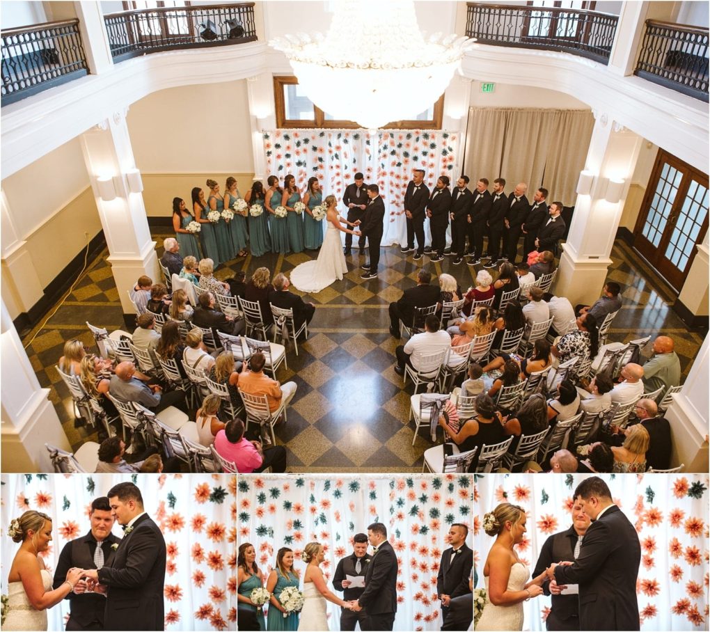 Premier snohomish & seattle wedding photographer | gsquared weddings photography a wedding ceremony in a bright room with a floral backdrop The bride and groom stand at the altar surrounded by bridesmaids in teal dresses and groomsmen in black suits as guests witness their vows at this lovely snohomish seattle wedding | serving snohomish seattle                   & beyond