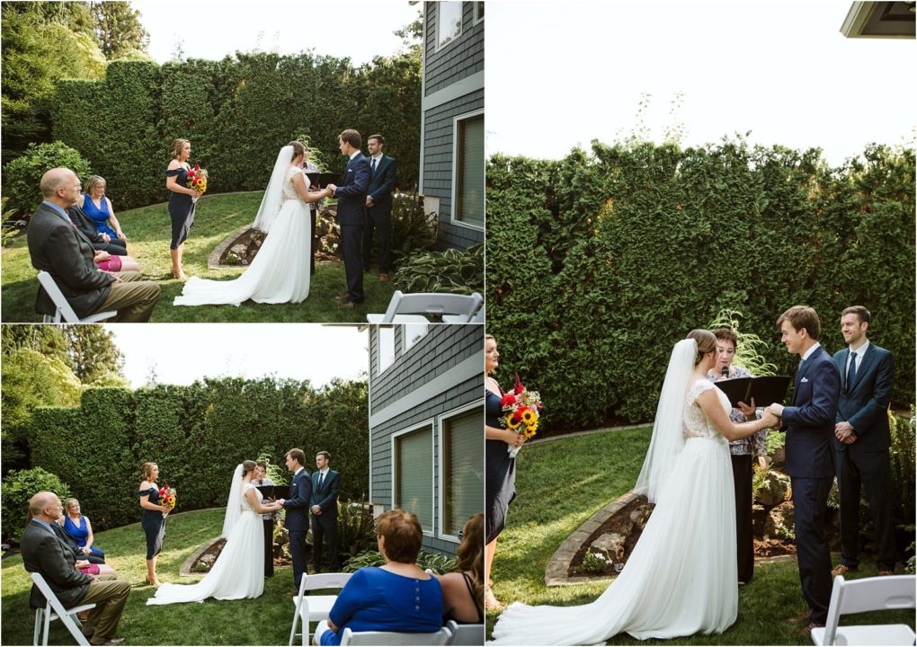 Premier snohomish & seattle wedding photographer | gsquared weddings photography a bride and groom exchange vows in a small outdoor snohomish wedding ceremony Guests sit on white chairs and the officiant stands with them in a green backyard near seattle surrounded by tall hedges and beautiful flower arrangements | serving snohomish seattle                   & beyond