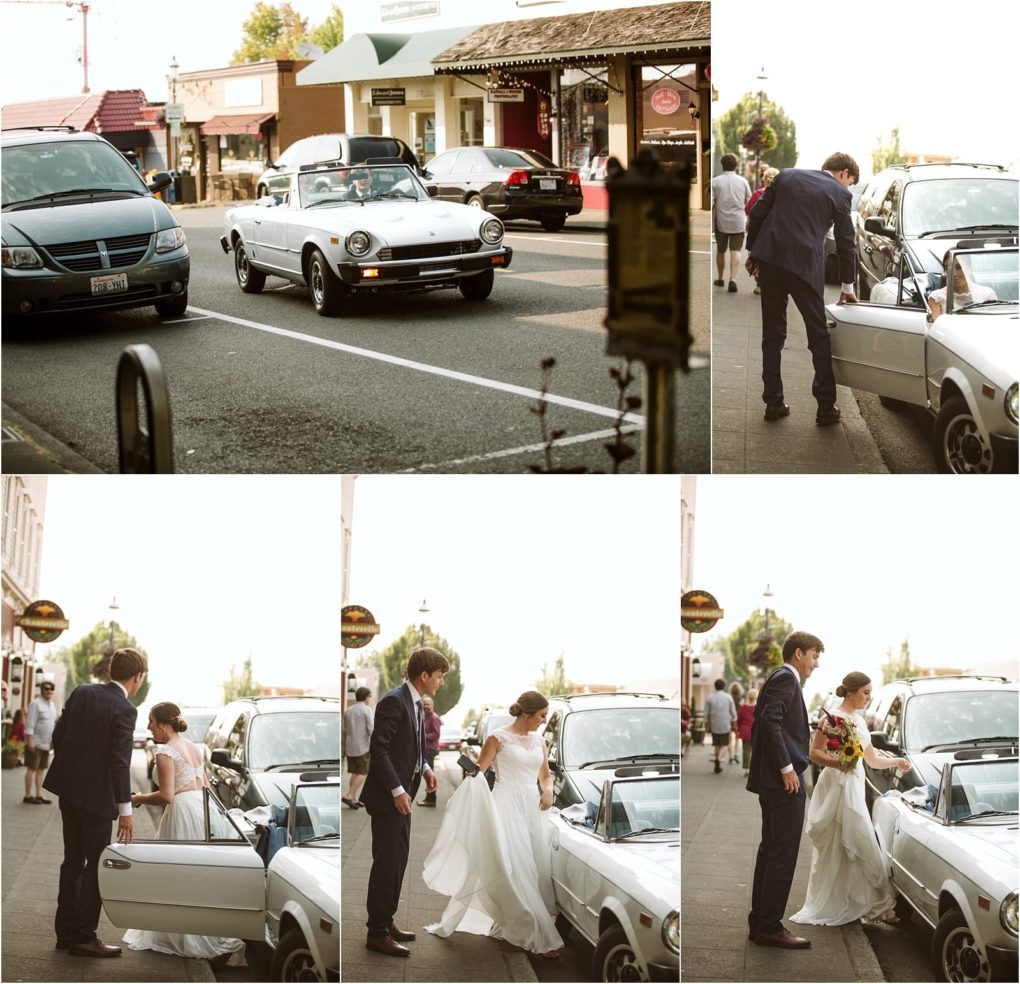 Premier snohomish & seattle wedding photographer | gsquared weddings photography a bride and groom stroll a city sidewalk during their snohomish seattle wedding with the groom helping the bride into a white vintage convertible The bride holds her dress and bouquet while shops and cars line the busy street | serving snohomish seattle                   & beyond