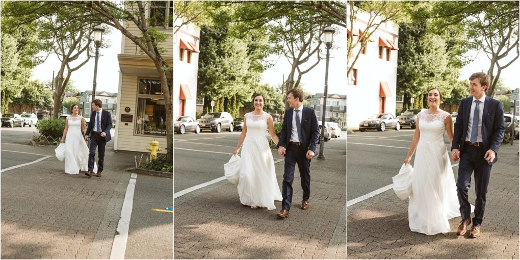 Premier snohomish & seattle wedding photographer | gsquared weddings photography a bride and groom dressed in a white wedding gown and navy suit walk hand in hand and smile at each other as they cross a tree lined city street in seattle capturing the joy of their snohomish seattle wedding | serving snohomish seattle                   & beyond