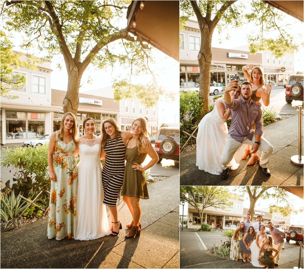 Premier snohomish & seattle wedding photographer | gsquared weddings photography four women in summer dresses and a man in a button down shirt pose for photos on a sunny day in downtown snohomish smiling and making playful gesturesperfect for a seattle wedding or engagement backdrop with trees and storefronts behind them | serving snohomish seattle                   & beyond