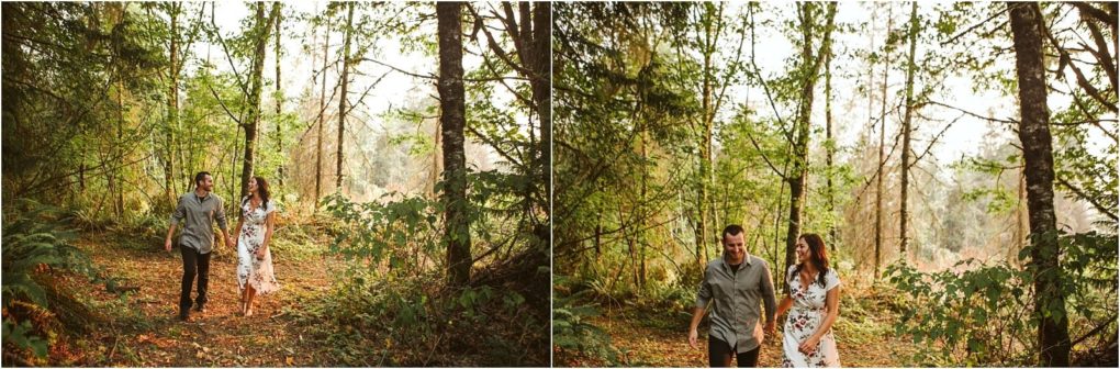 Premier snohomish & seattle wedding photographer | gsquared weddings photography a couple walks together through a lush sunlit forest near snohomish smiling and holding hands Surrounded by tall trees and green foliage they savor a peaceful seattle wedding engagement moment in nature | serving snohomish seattle                   & beyond