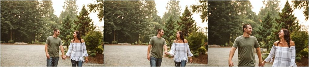 Premier snohomish & seattle wedding photographer | gsquared weddings photography a couple walks hand in hand outdoors on a gravel path smiling and looking at each other surrounded by greenery and trees on a sunny snohomish daythe perfect seattle wedding engagement moment | serving snohomish seattle                   & beyond
