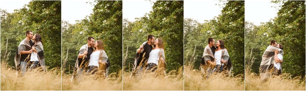 Premier snohomish & seattle wedding photographer | gsquared weddings photography a couple wrapped in a blanket walks through tall grass sharing affectionate moments and kisses amid lush green trees in a series of four candid snohomish engagement photos | serving snohomish seattle                   & beyond