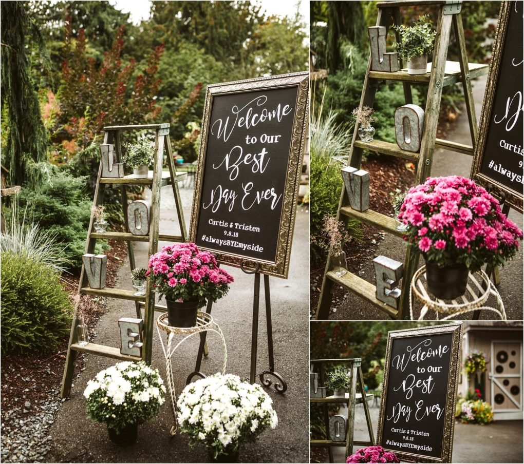 Premier snohomish & seattle wedding photographer | gsquared weddings photography rustic wedding decor for a snohomish seattle wedding featuring a chalkboard sign reading welcome to our best day ever potted pink and white flowers and an old wooden ladder with the letters l o v e on its steps | serving snohomish seattle                   & beyond