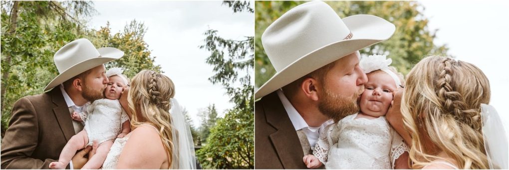 Premier snohomish & seattle wedding photographer | gsquared weddings photography a man in a tan cowboy hat and a woman in a white dress kiss a baby dressed in white lace Outdoors near snohomish theyre surrounded by greenery smiling and sharing an affectionate engagement moment | serving snohomish seattle                   & beyond